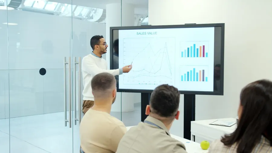 A presenter taking a team through a marketing plan